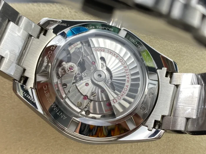 Display caseback with the rotor and Aqua Terra ring, white and rose tone Aqua Terra