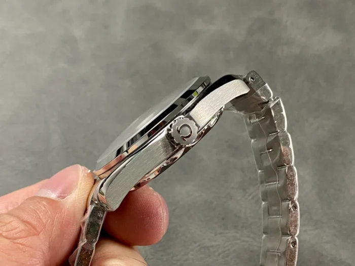 Crown side held between fingers