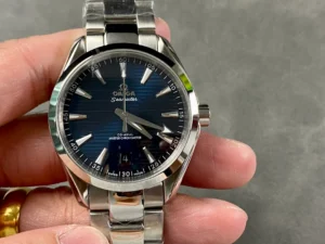 Held in hand from the front, dark blue dial