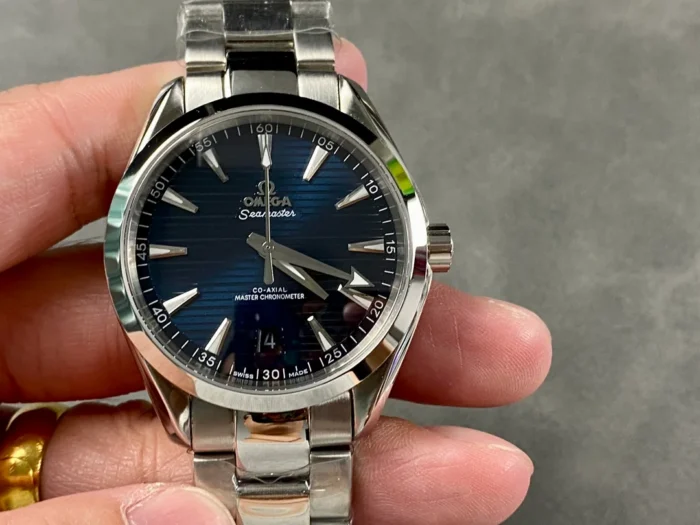 Held in hand from the front, dark blue dial