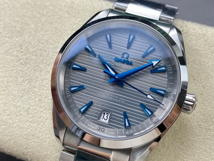 Grey dial from the left, blue arrow minute hand