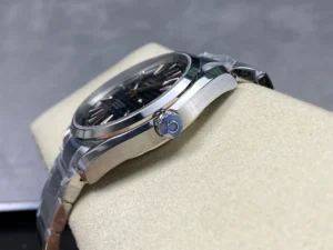 Crown side on the cushion, dark dial at an angle