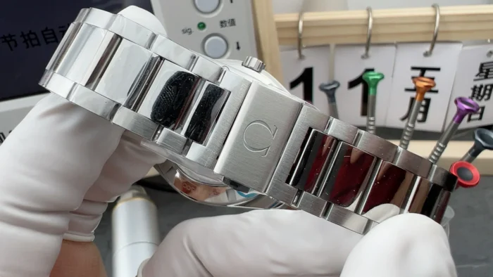 Clasp side of the bracelet in a gloved hand