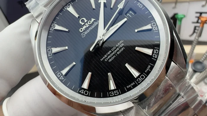 Close-up of the black dial with vertical lines and Master Co-Axial text