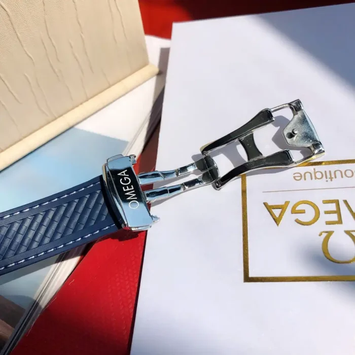 Folding buckle of the blue rubber strap on a white card