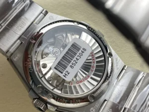 Display caseback of the 38mm textured white model, automatic rotor and barcode sticker