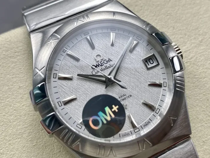 Close-up of the white textured dial and baton hour markers, hologram sticker on the crystal