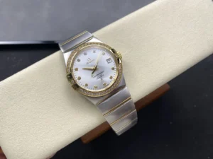 The two-tone 38mm silver dial model on a cushion at an angle