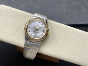Wider shot of the two-tone 38mm silver dial model on the cushion with its silver and yellow gold tone bracelet