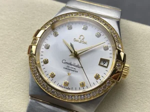 Silver sunray dial seen from the left, stone set yellow gold tone bezel in view