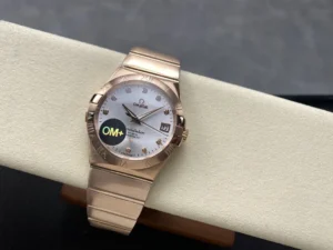 The rose gold tone 38mm stone model on a cushion at an angle