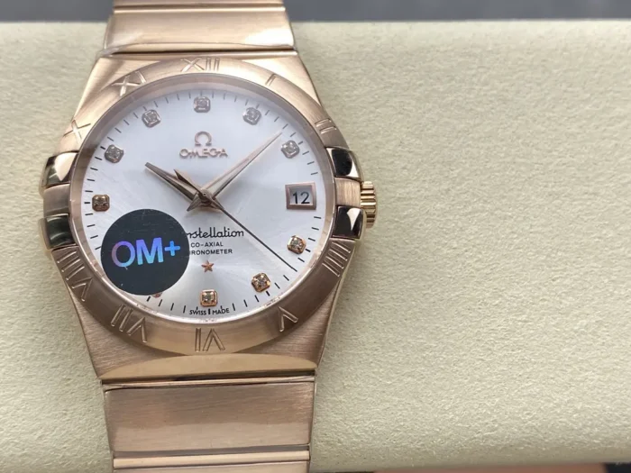 Front view on a cushion, white dial with stone markers in a rose gold tone case