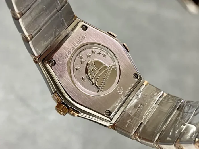 Solid caseback of the 25mm rose gold tone model, engraved observatory medallion