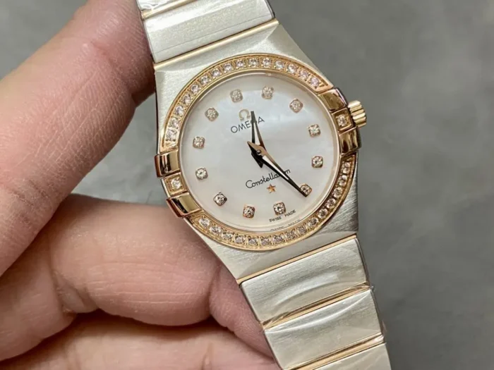 Omega Constellation 131.25.25.60.55.002 in hand, stone set rose gold tone bezel