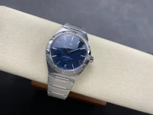 Wider shot of the 41mm blue textured model on the cushion with its silver tone bracelet