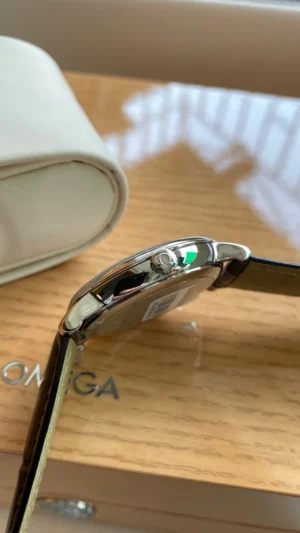Crown side of the slim case above the Omega box lettering
