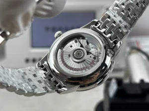 Display caseback with red rotor lettering, bracelet in film