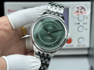 Held in a glove, green dial and silver tone bracelet