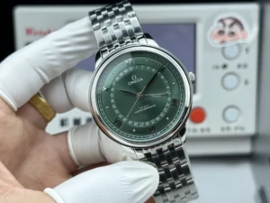 Green sunray dial facing forward on the silver tone bracelet