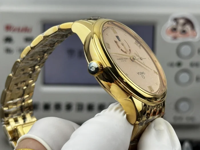 Crown side of the gold tone case at an angle