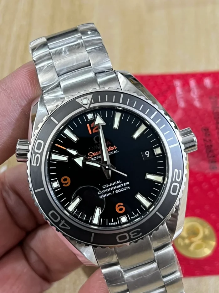 Omega Planet Ocean 600M 42mm on the bracelet, held in hand