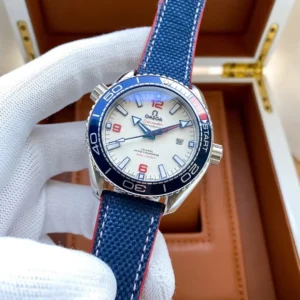 Omega Planet Ocean America's Cup 215.32.43.21.04.001 held in a gloved hand