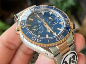 Angled dial in hand, round sticker on the bracelet