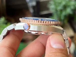 Case side with the valve, ridged rose gold tone bezel edge