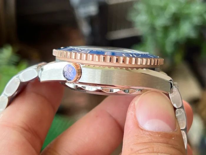 Case side with the valve, ridged rose gold tone bezel edge