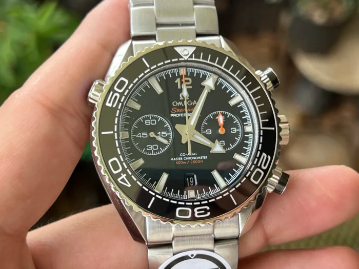 Dial from the left in hand, orange chronograph hand