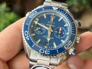 Held in hand from the front, blue dial and subdials