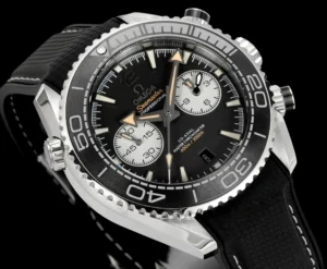 Watch angled to the left on black, beige tipped hands