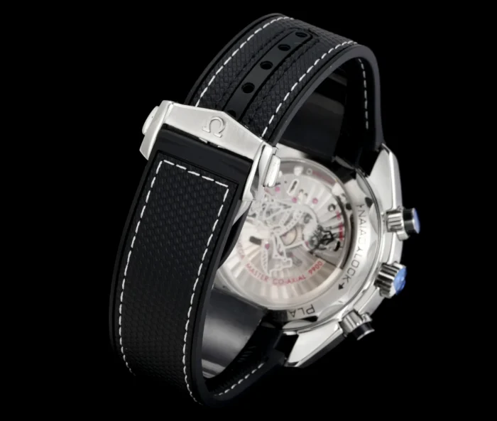 Caseback and black strap with white stitching, on black