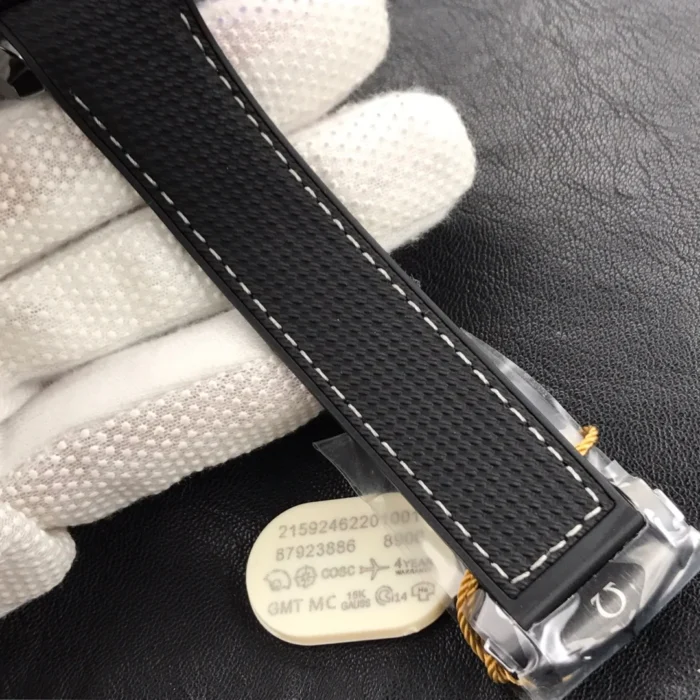 Strap end with a plastic hang tag printed with the reference