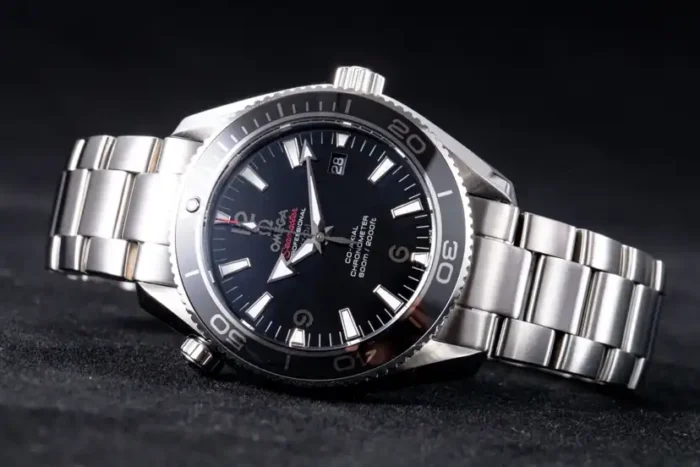 Watch lying at an angle on dark fabric