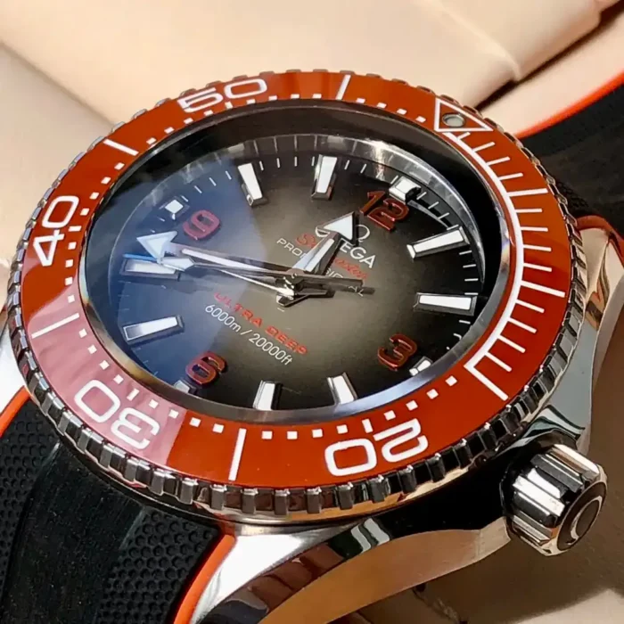 Close-up of the gradient dial and orange bezel scale