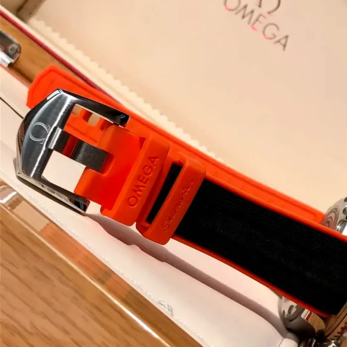Orange underside of the strap and the pin buckle, in a box