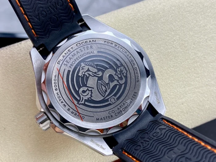 Solid caseback with the seahorse emblem, black strap