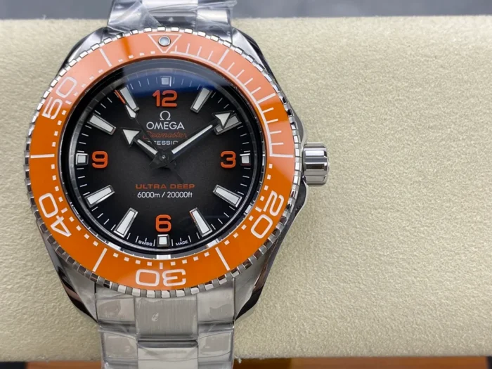 Omega Planet Ocean Ultra Deep orange bezel on a display cushion, front
