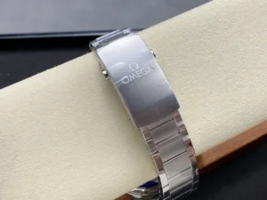 Closed clasp signed Omega, bracelet wrapped around the cushion