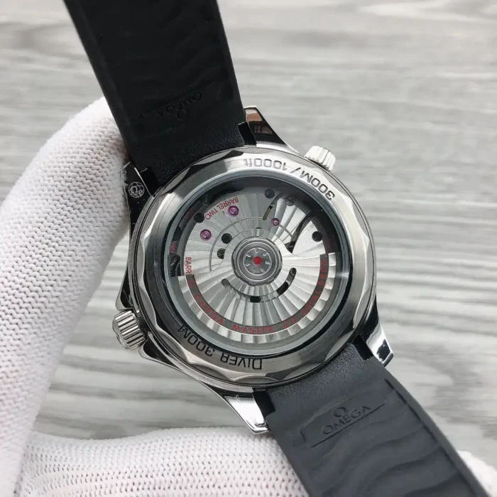 Clear caseback in a white glove, rotor and Diver 300M engraving