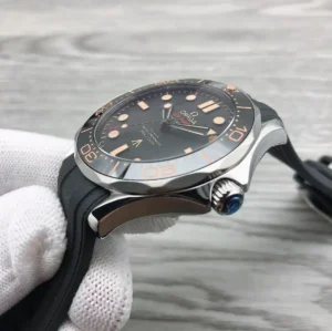 Crown side in a white glove, bezel numerals from the side