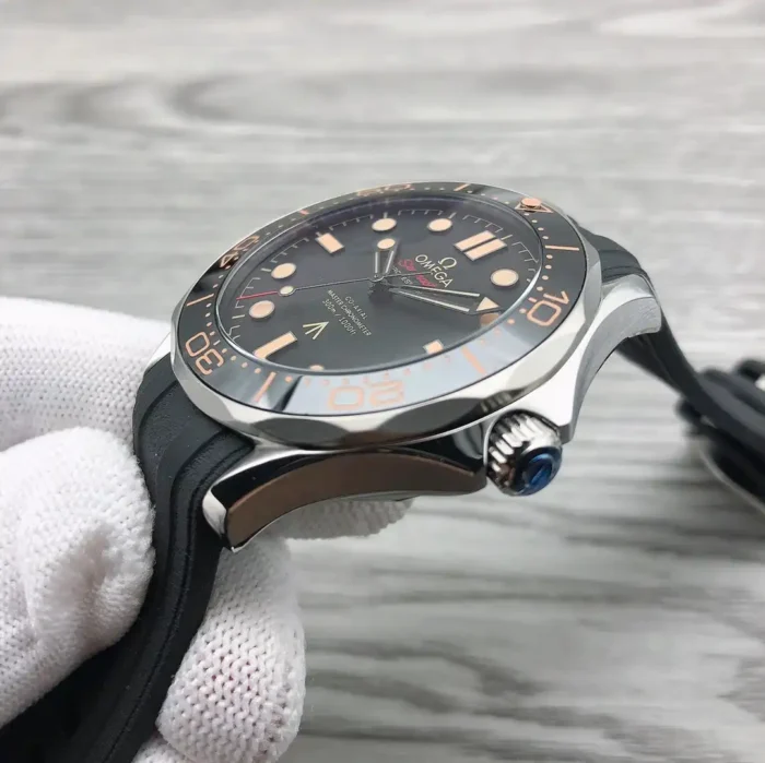 Crown side in a white glove, bezel numerals from the side