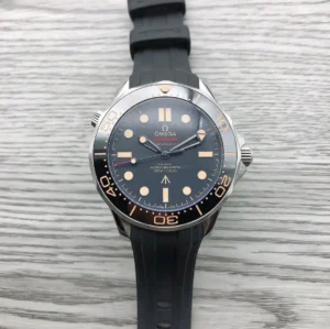 Front view on a wood grain surface, black rubber strap
