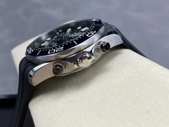 Crown side with the two pushers over a black rubber strap