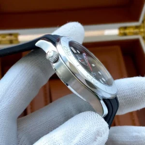 Crown side of the case on a black rubber strap