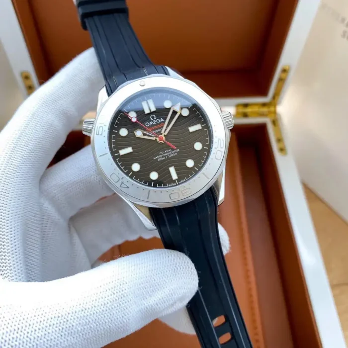 Black wave dial with red seconds hand, open wooden box behind