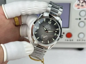 Dial in hand from the left with a hang tag on the bracelet