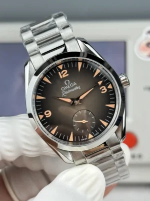 Brown fume dial with orange numerals, held in finger cots