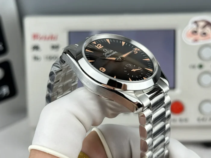 Dial at an angle from the right, orange hands catching light